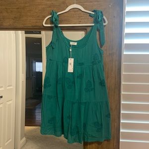 Green swing dress with tie straps. Embroidered leaves. Never worn.